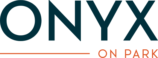 A green sign with the words "ONYX ON PARK" written in white.